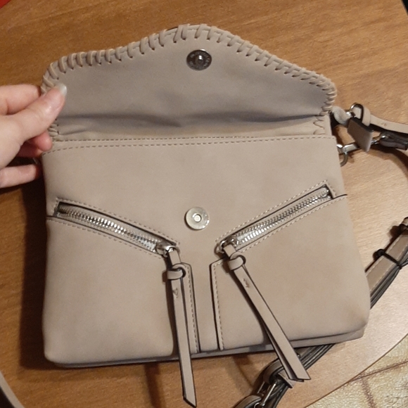 Tan purse with black accents along edges. - Picture 3 of 6